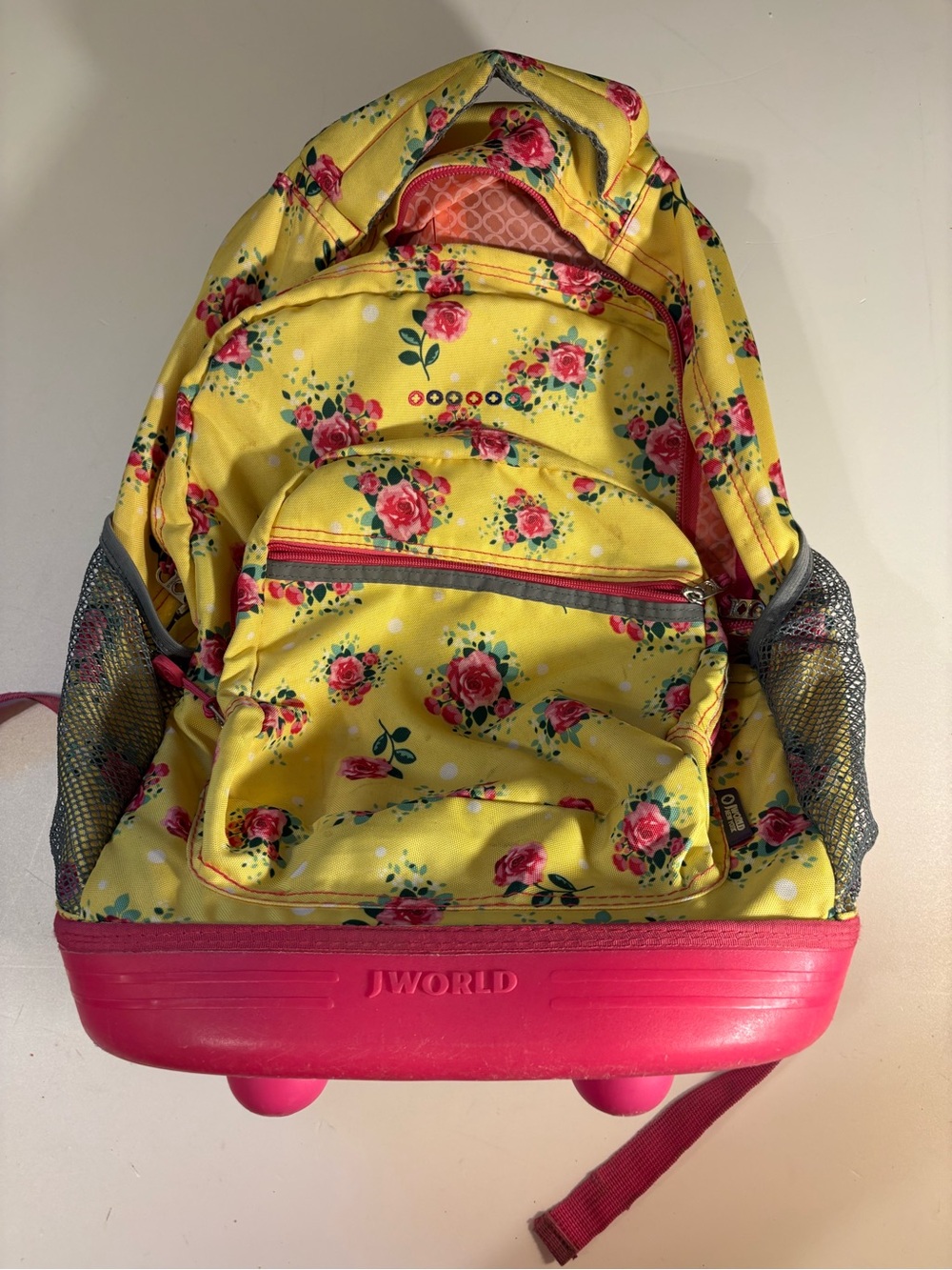 J World rolling Yellow Floral Backpack with Pink Base